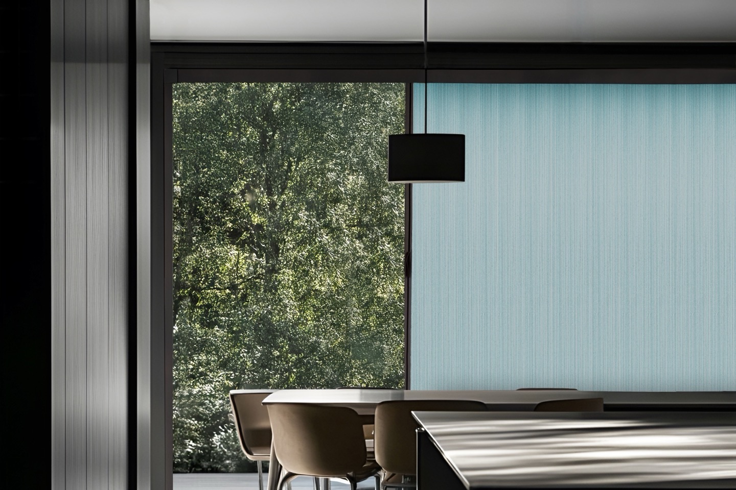 Blind Screen&reg; drawn across full-height glazing in a modern dining room