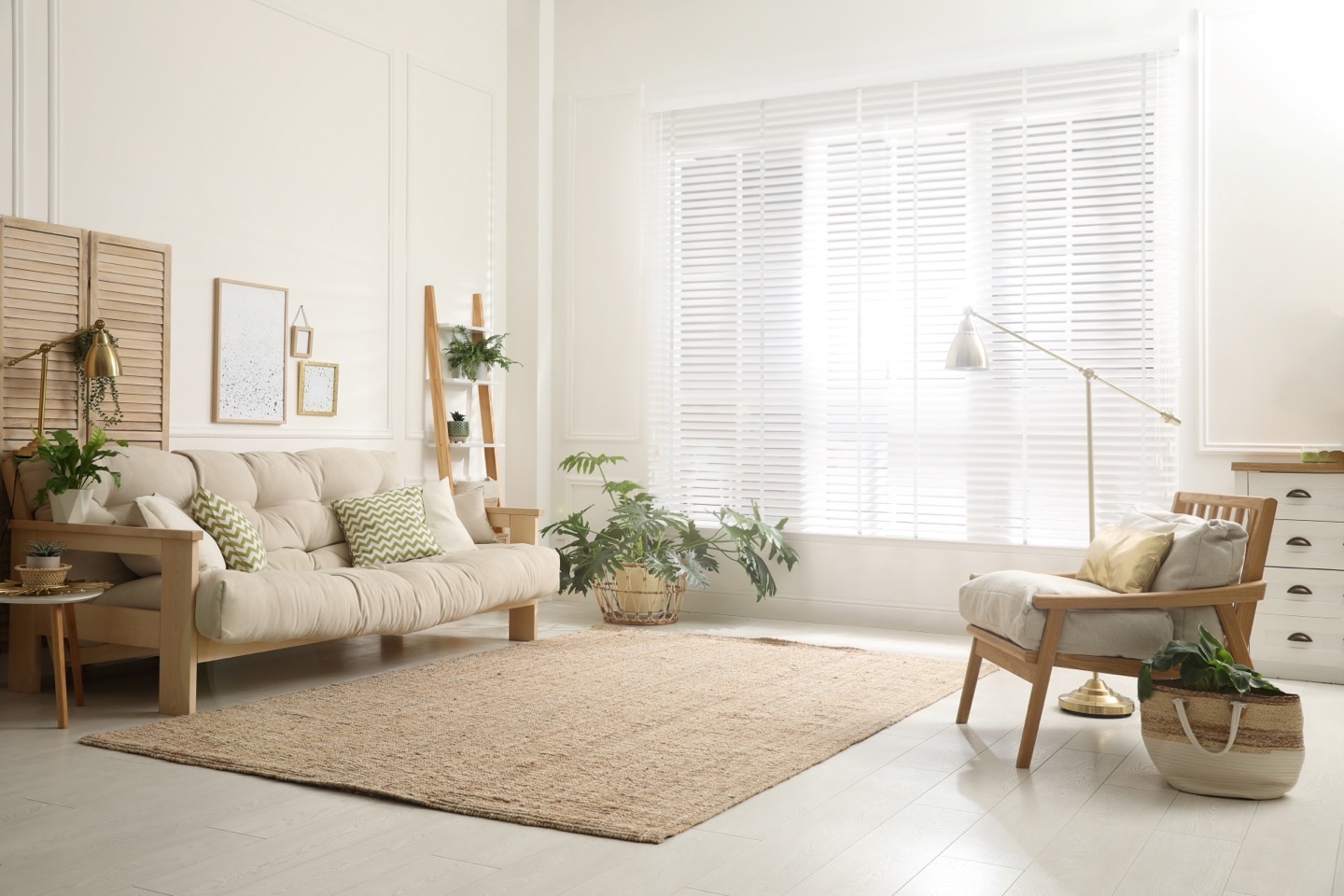 White Venetian blinds across a bay window in a bright living room